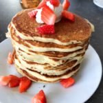 Buttermilk pancakes with sour cream and strawberries