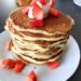 Buttermilk pancakes with sour cream and strawberries