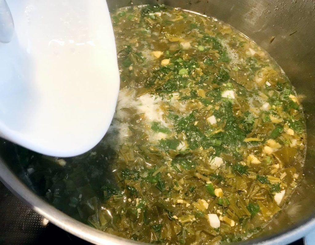 Add liquid sour cream to soup pot