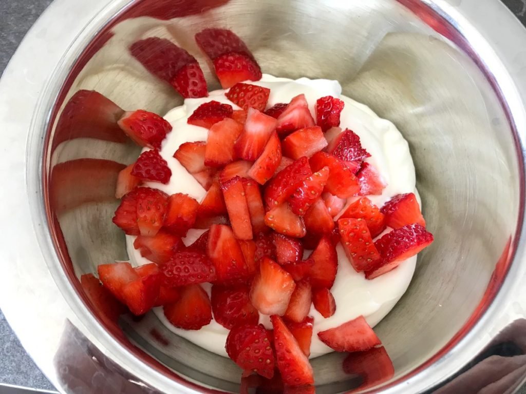 Add strawberries to cream