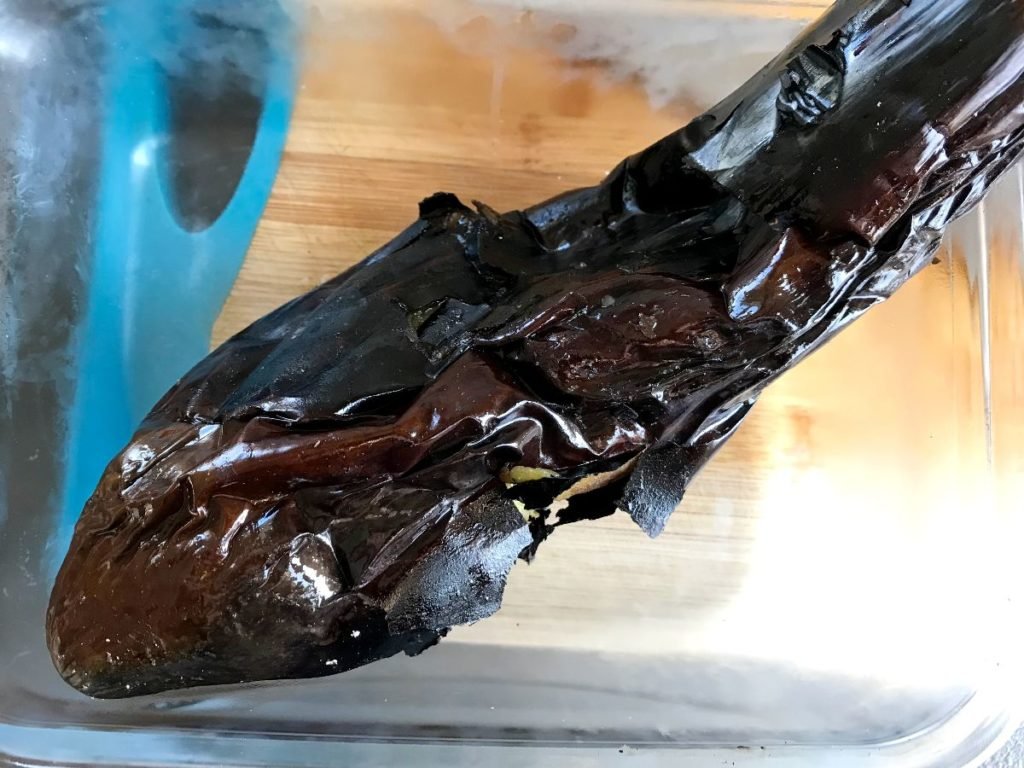 Grill eggplant until charred