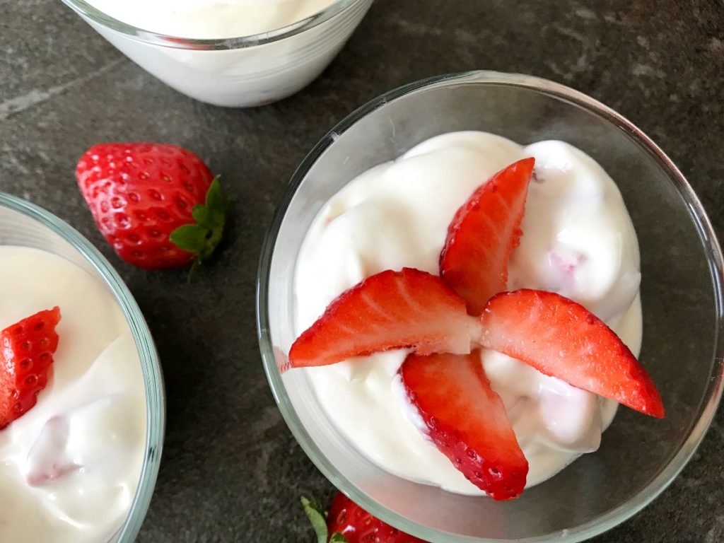 Quark and whipping cream with strawberries