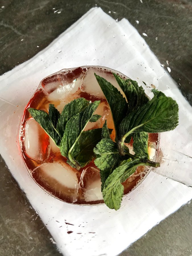 Mint in pitcher with iced black tea