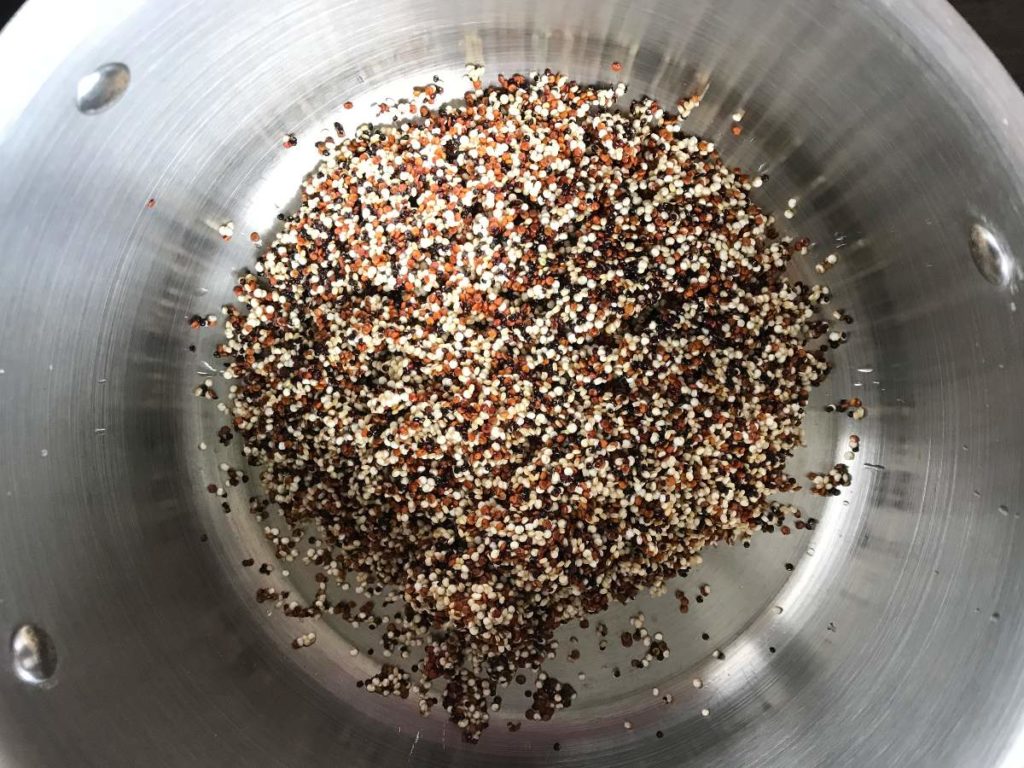 Quinoa added to cooking pot