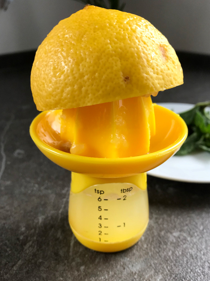 Half a lemon being juiced