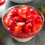 Chia dessert in glass topped with strawberries