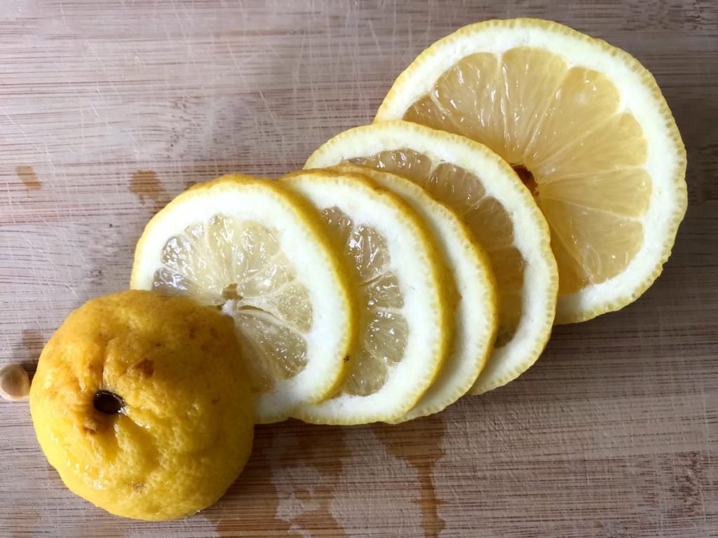 Lemon sliced on cutting board