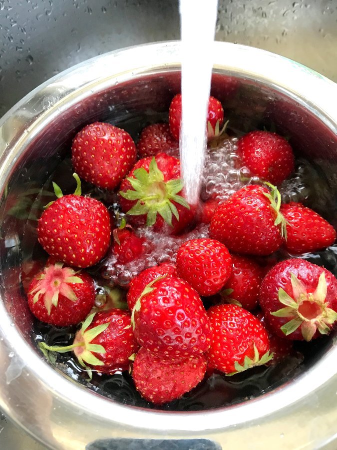 Wash strawberries