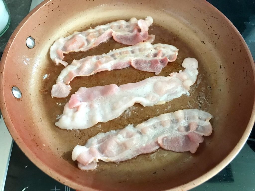 Bacon frying in pan