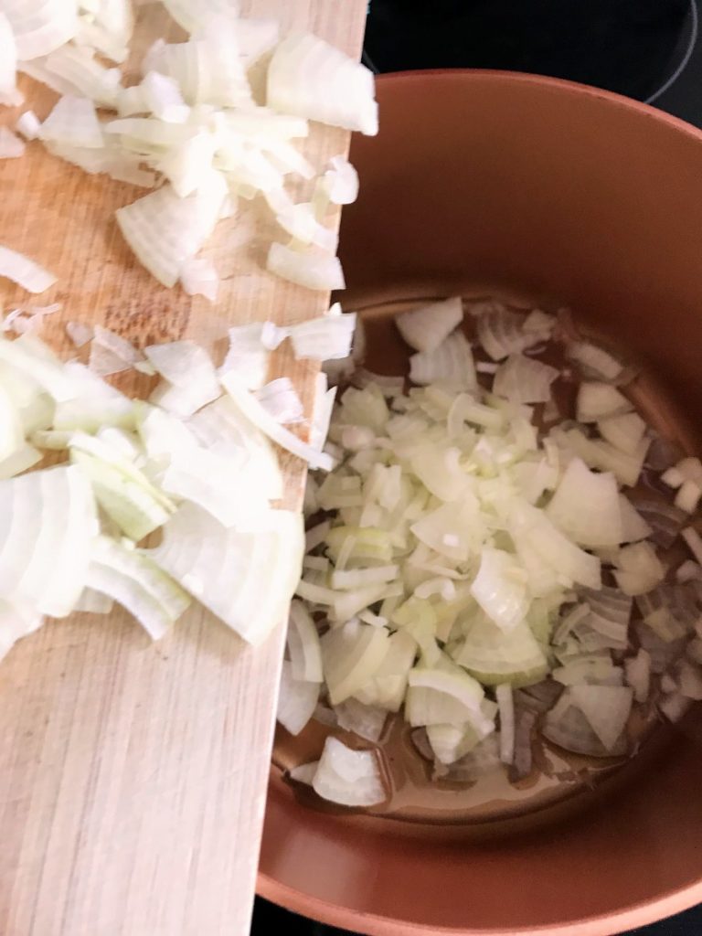 Chopped onions added to frying pan