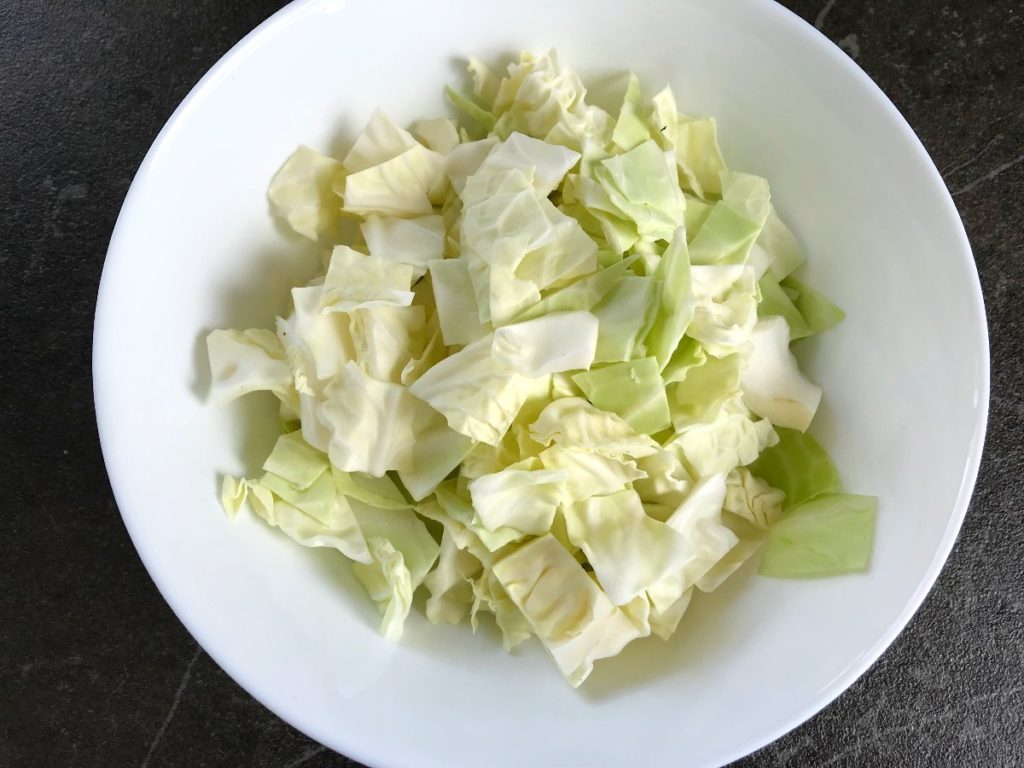 Cut conehead cabbage in a salad bowl