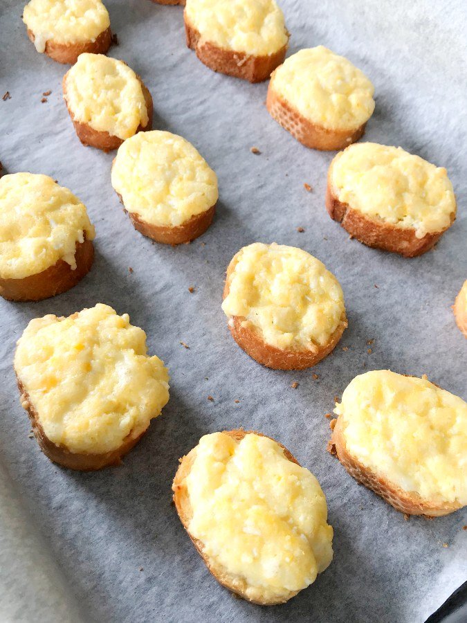 Egg and Cheese Crostini on baking sheet