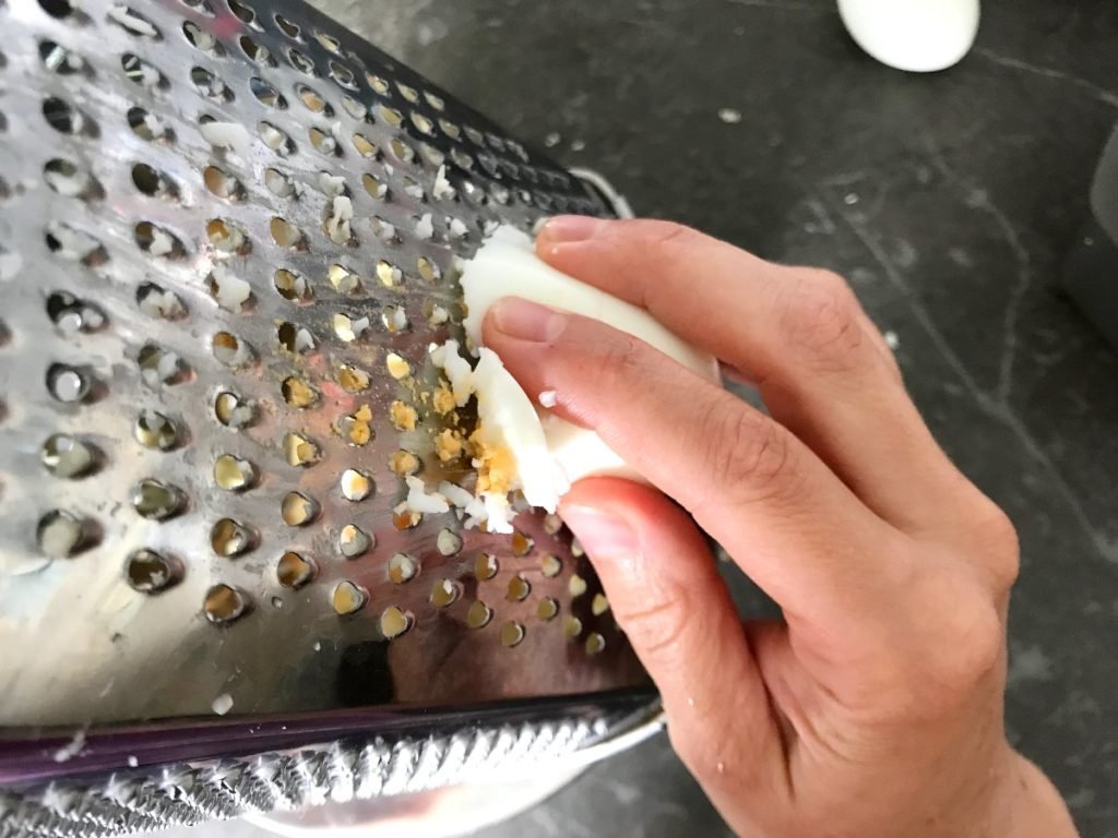 Egg grated on a box grater