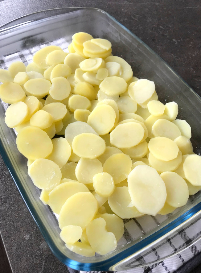 Potatoes spread in casserole dish