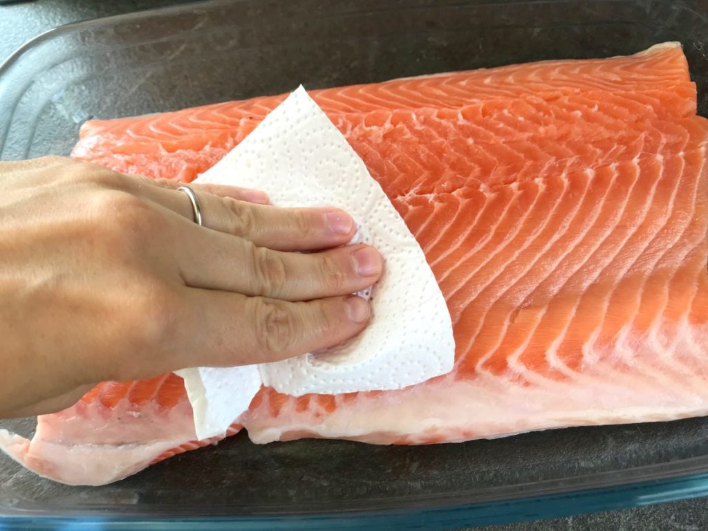 Salmon filet dried with a paper towel