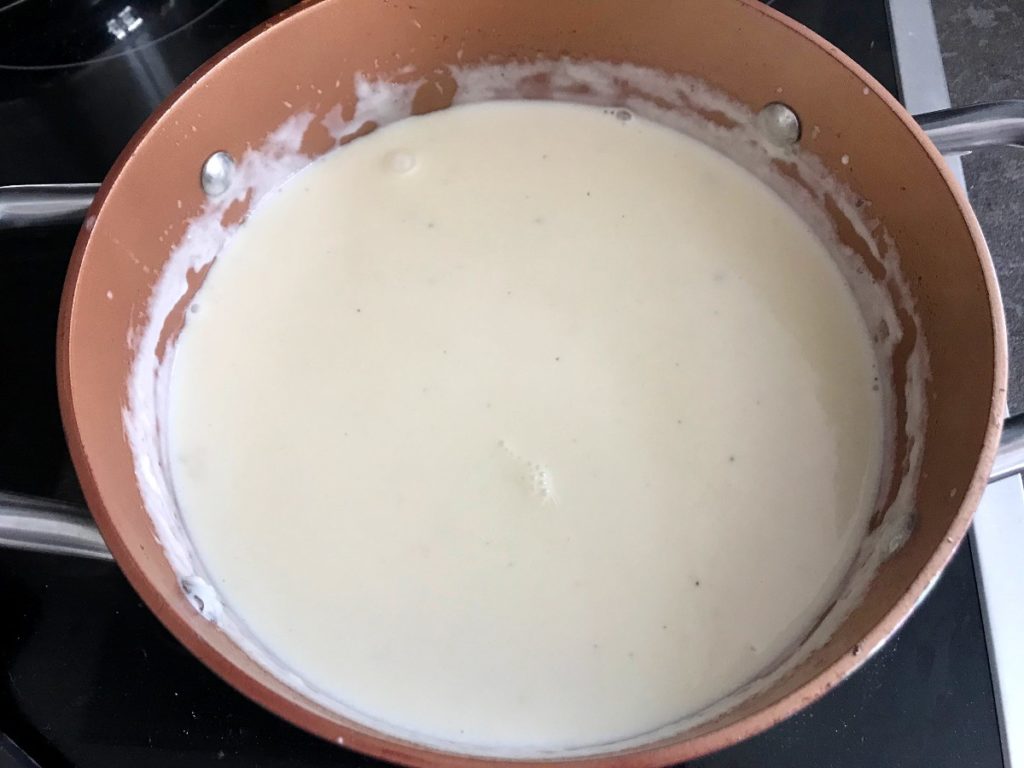 Final white sauce in a pot