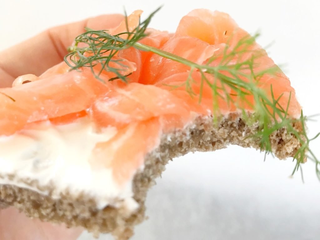 Open Sandwich with Cured Salmon Lox bit off