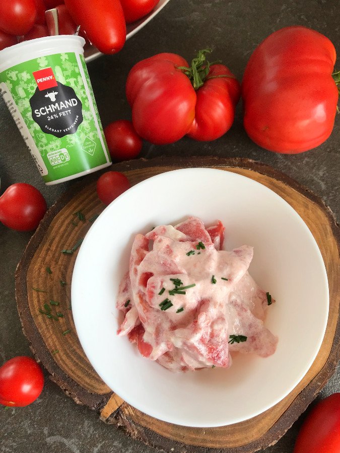 Tomato Salad with sour cream served in a bowl