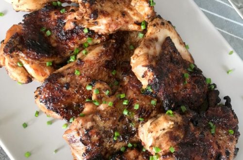Grilled chicken thighs on a platter