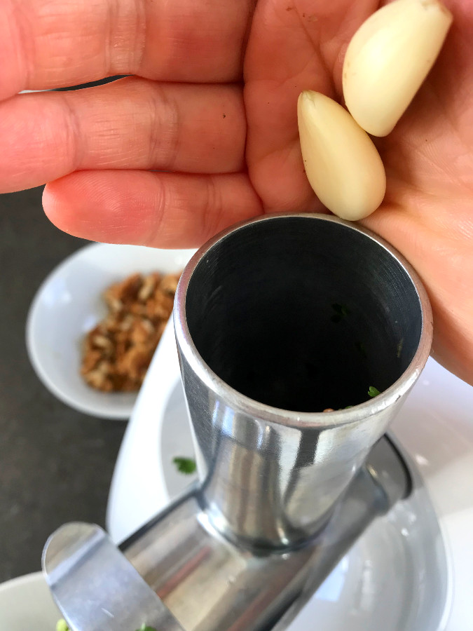 Garlic added to meat grinder