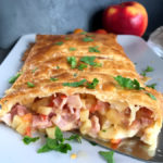 Ham and Cheese Pastry with Apples served on a plate.