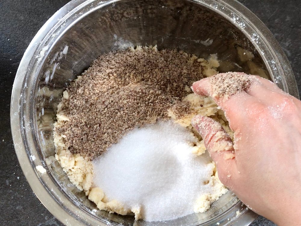 Sugar and ground almonds added to butter and flour.
