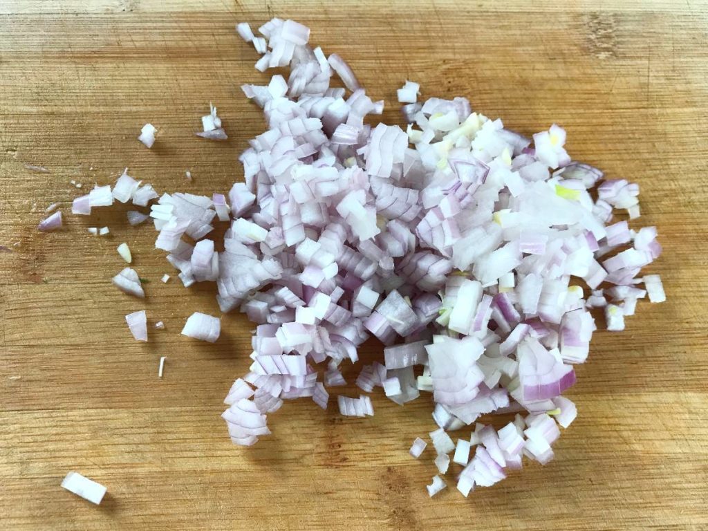 Finely chopped onion shallots on a cutting board