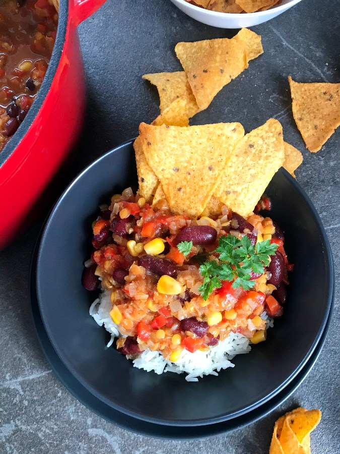 Easy Vegetable Chili served with rice and tortilla chips