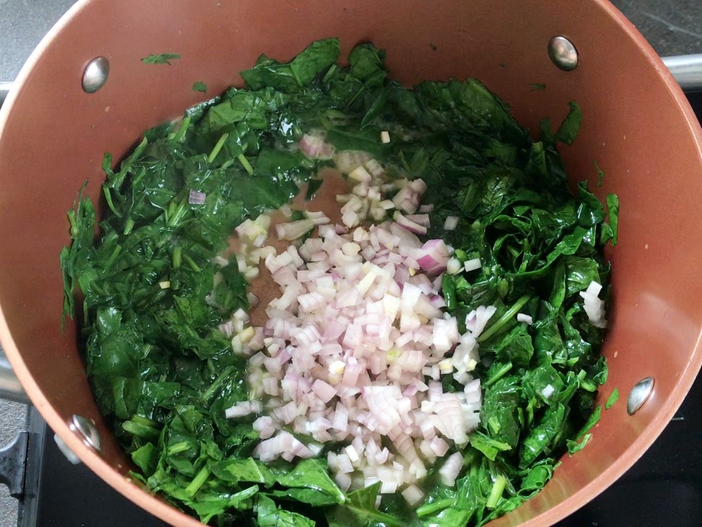 Chopped shallots added to the spinach.