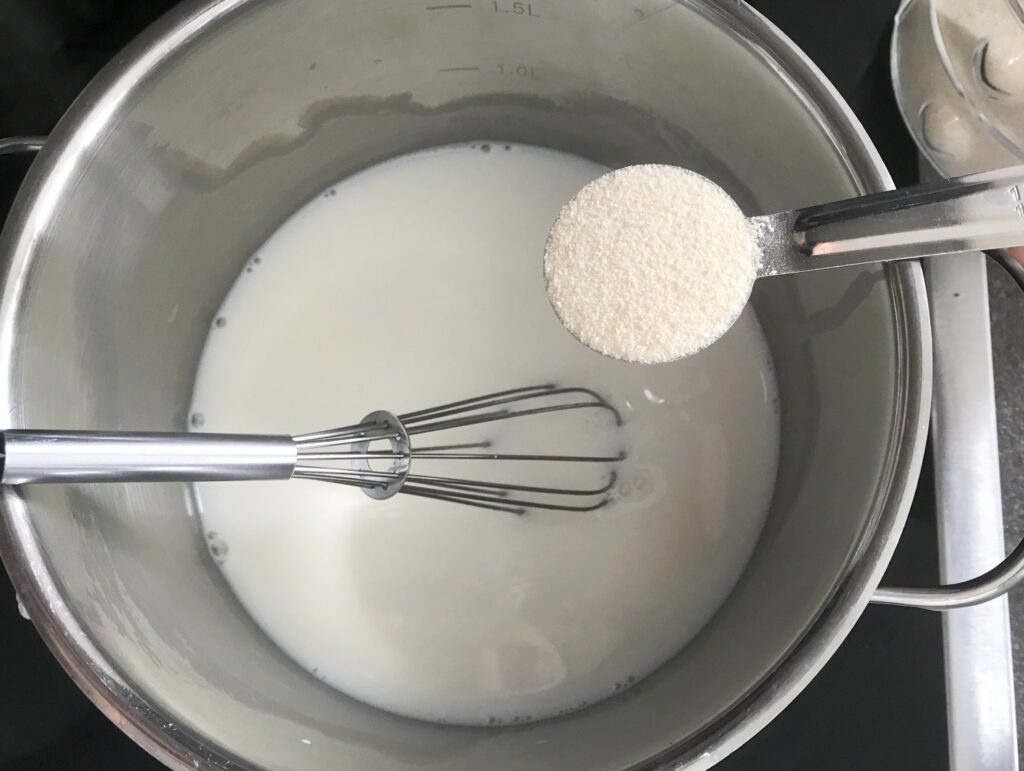 Cream of Wheat added to milk in a small saucepan
