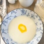 Cream of Wheat porridge hot cereal served in a bowl with a sliver of melting butter.