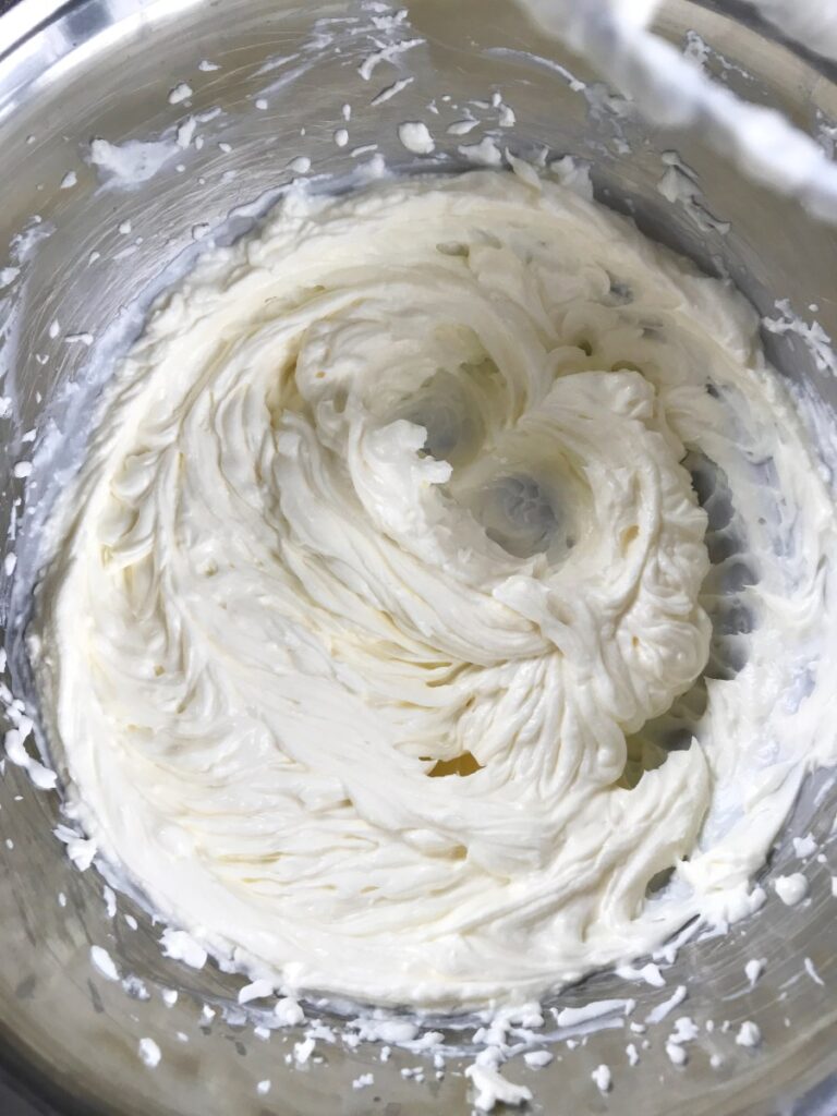 Cream cheese and sugar beat together in a bowl