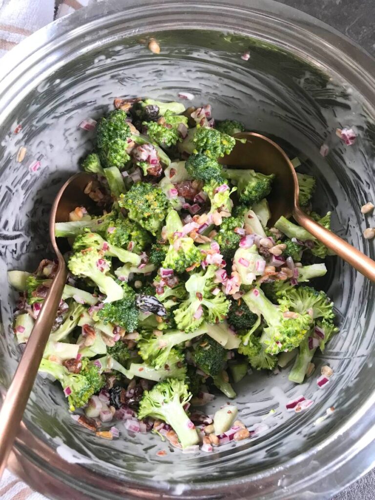 Broccoli Cranberry Bacon Salad in a stainless steel salad bowl.