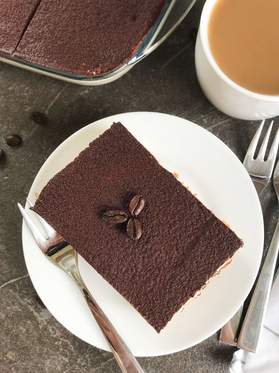 Easy tiramisu served on a plate with a cup of coffee