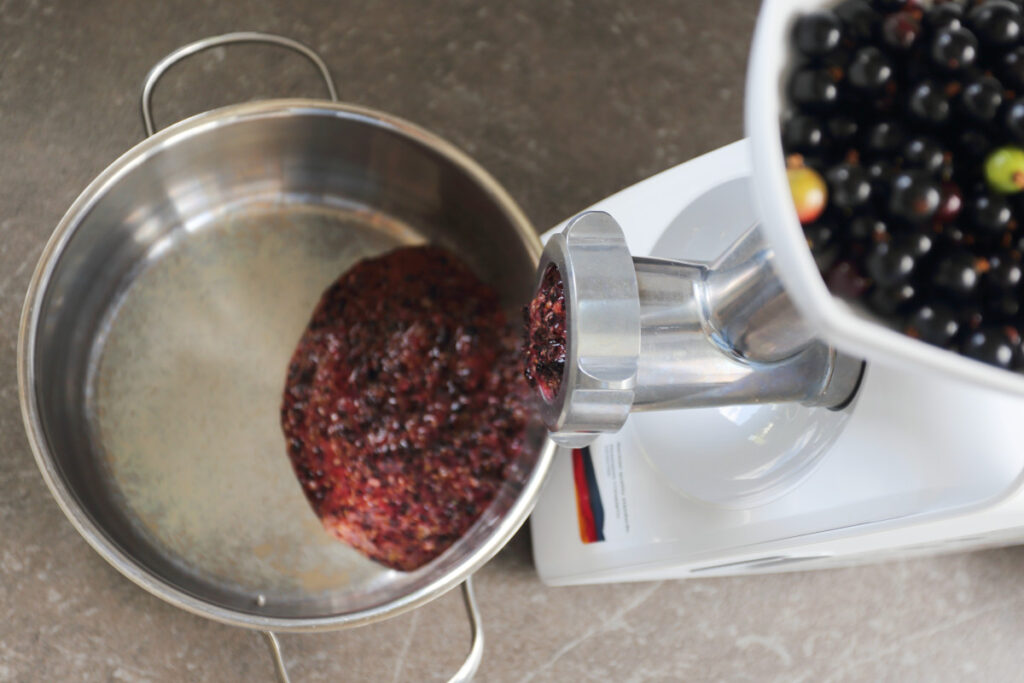 Black currant berries ground using a meat grinder.