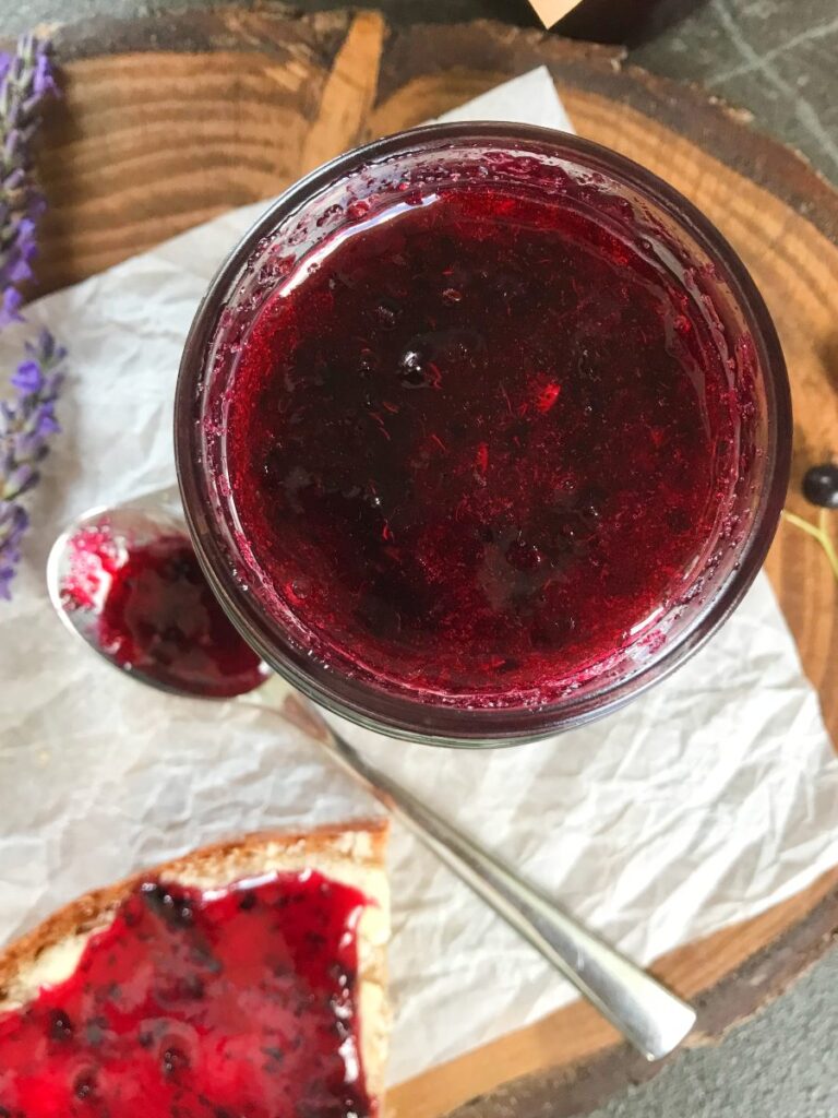 No-cooking, no-canning black currant jam in a glass.