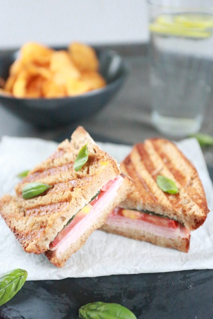 Panini sandwich with ham and tomatoes.