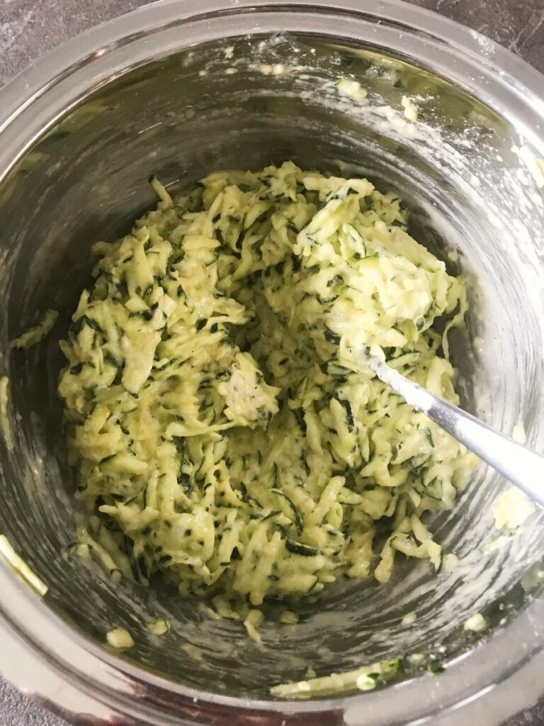 Shredded Zucchini and flour mixed together.