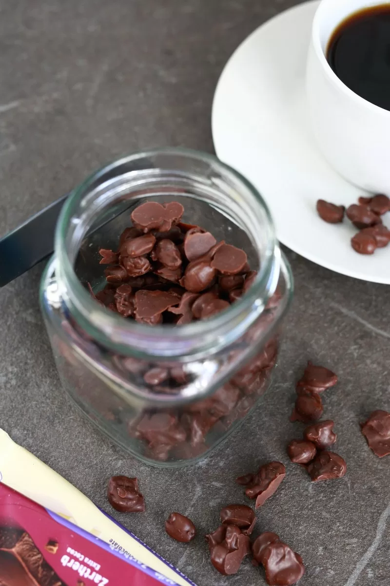 Chocolate Covered Coffee beans in a glass jar.