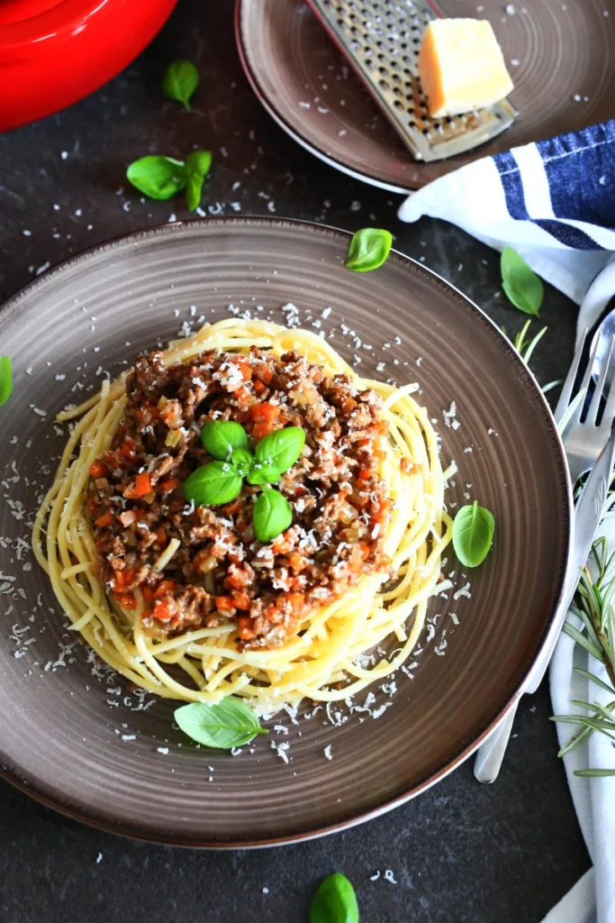 Spaghettoni with Ground Beef Sauce served on a plate.