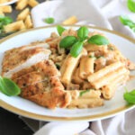 Marry Me Chicken Pasta served on a plate and garnished with Basil.