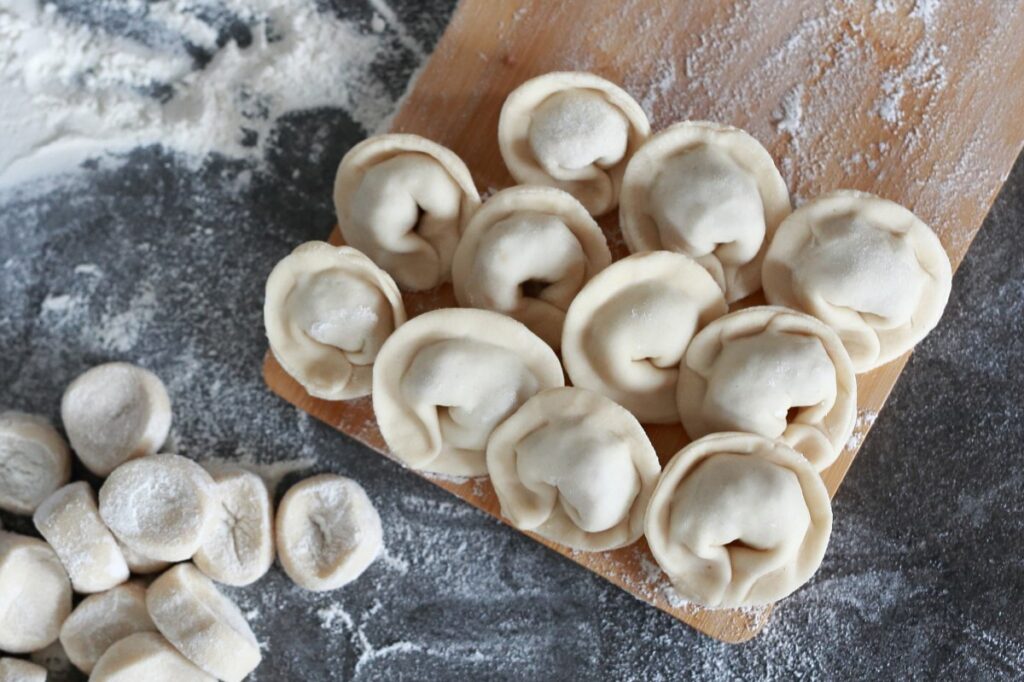 Finished pelmeni on a cutting board