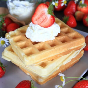 Belgian Waffles with Kefir served stacked on a platter.