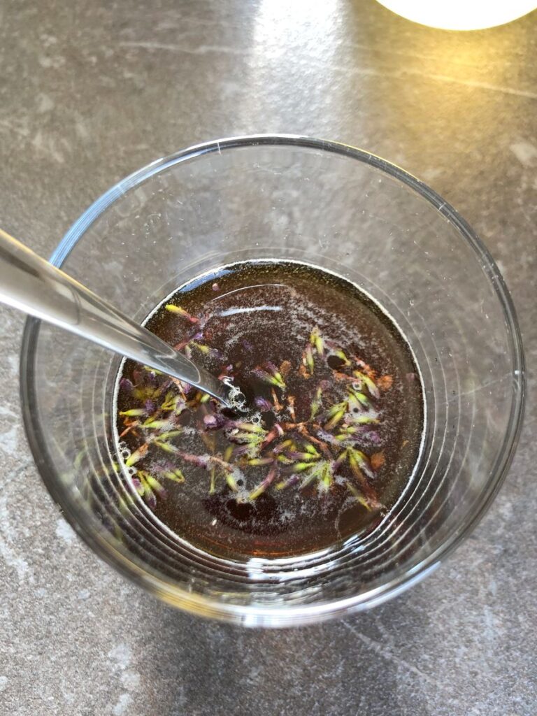 Cold brew added to lavender flowers and honey