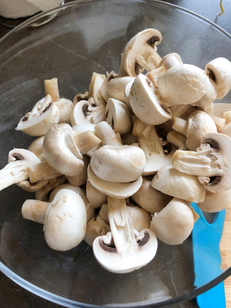 Halved mushrooms in a bowl