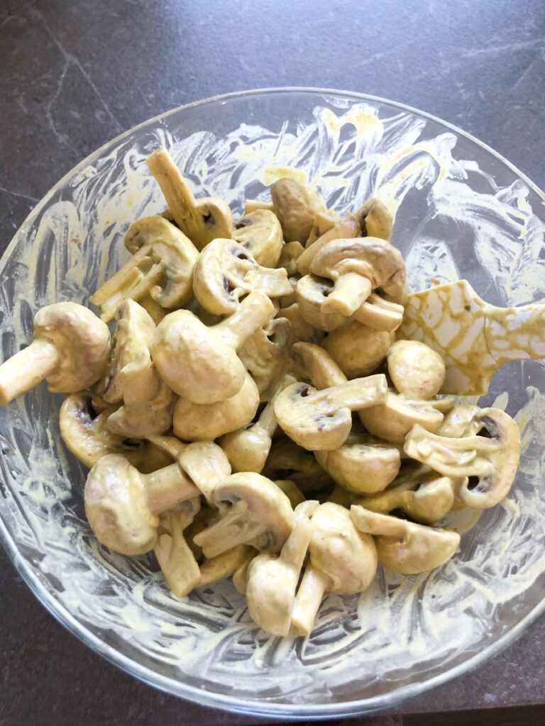 Mushrooms marinating in a bowl