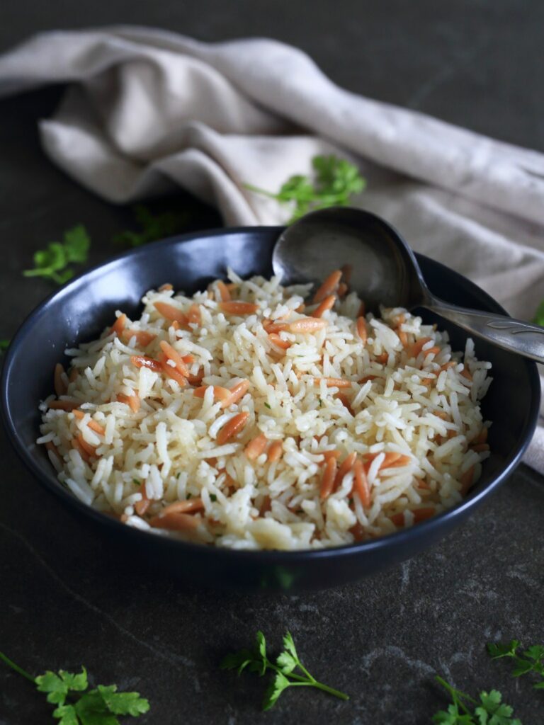 Orzo rice served in a bowl.