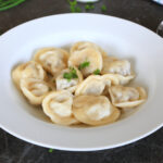 Pelmeni meat dumplings served in a bowl