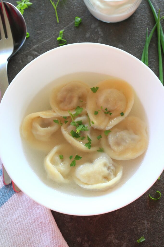 Pelmeni meat dumplings served in a bowl.