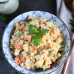 Olivye Russian Potato Salad served in a bowl.